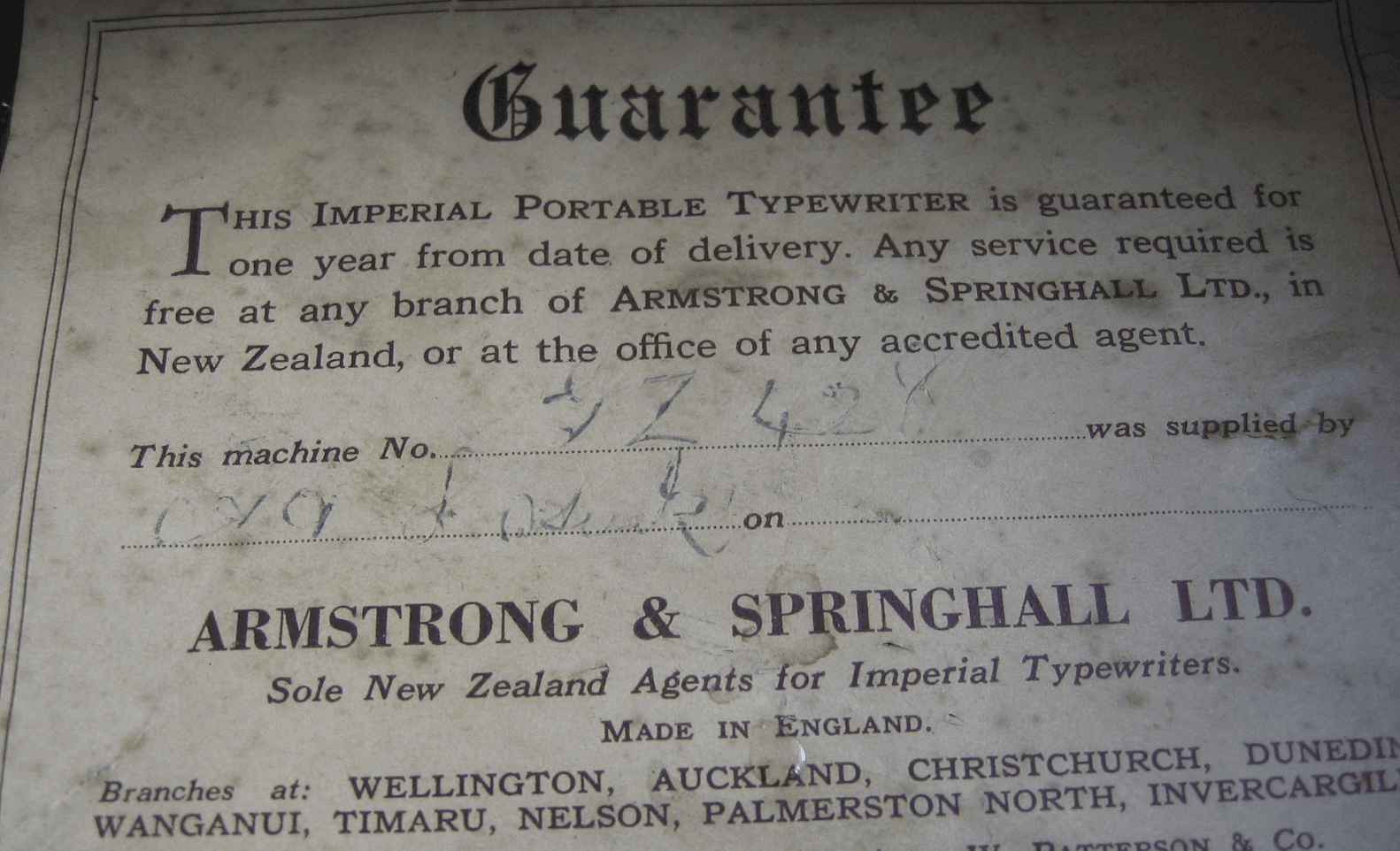 Old writ of guarantee for a typewriter sold by a local business.