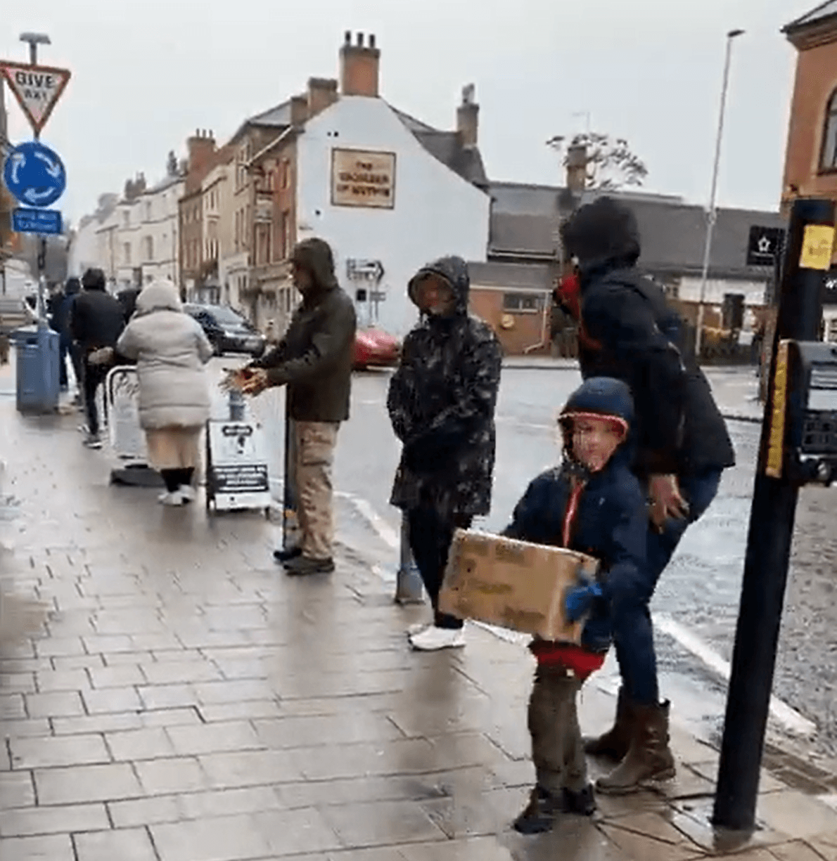 People lining up to help a business move to a new location